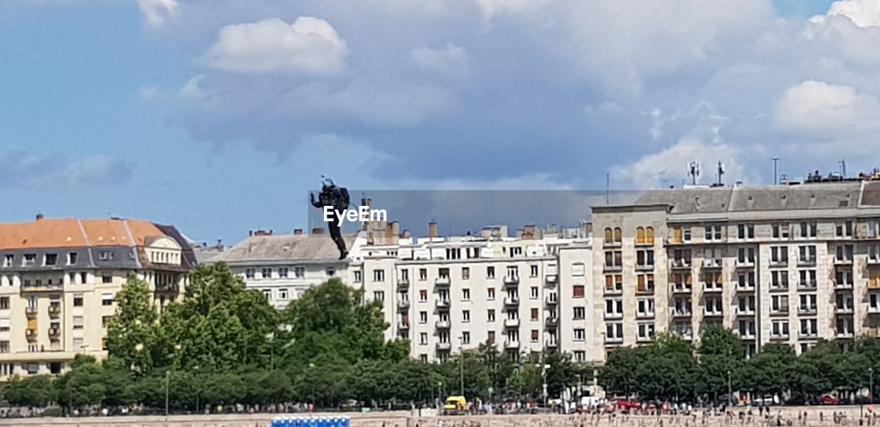 BUILDINGS IN CITY AGAINST SKY