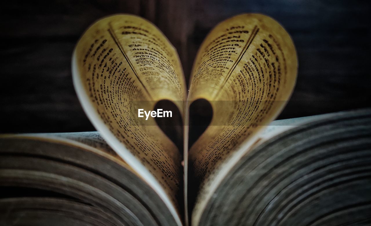 Close-up of heart shape on book