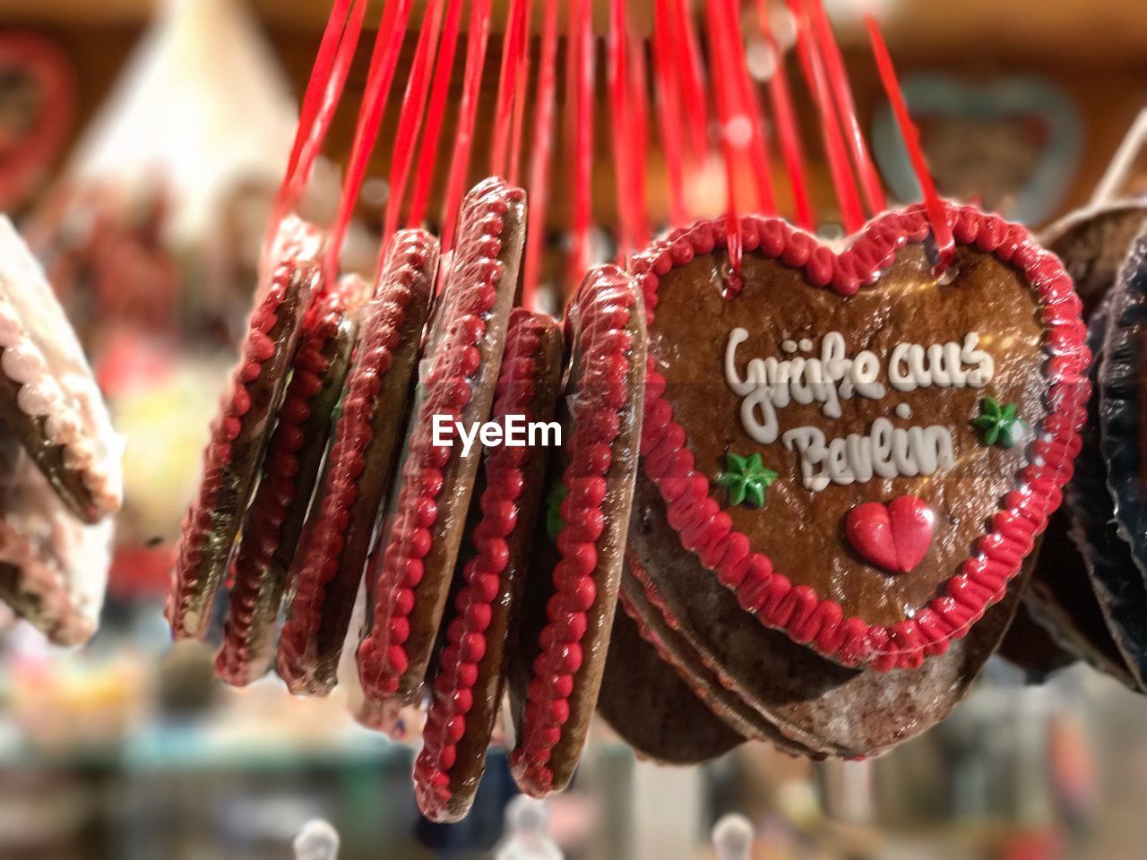 CLOSE-UP OF HEART SHAPE MADE OF CAKE HANGING ON DISPLAY