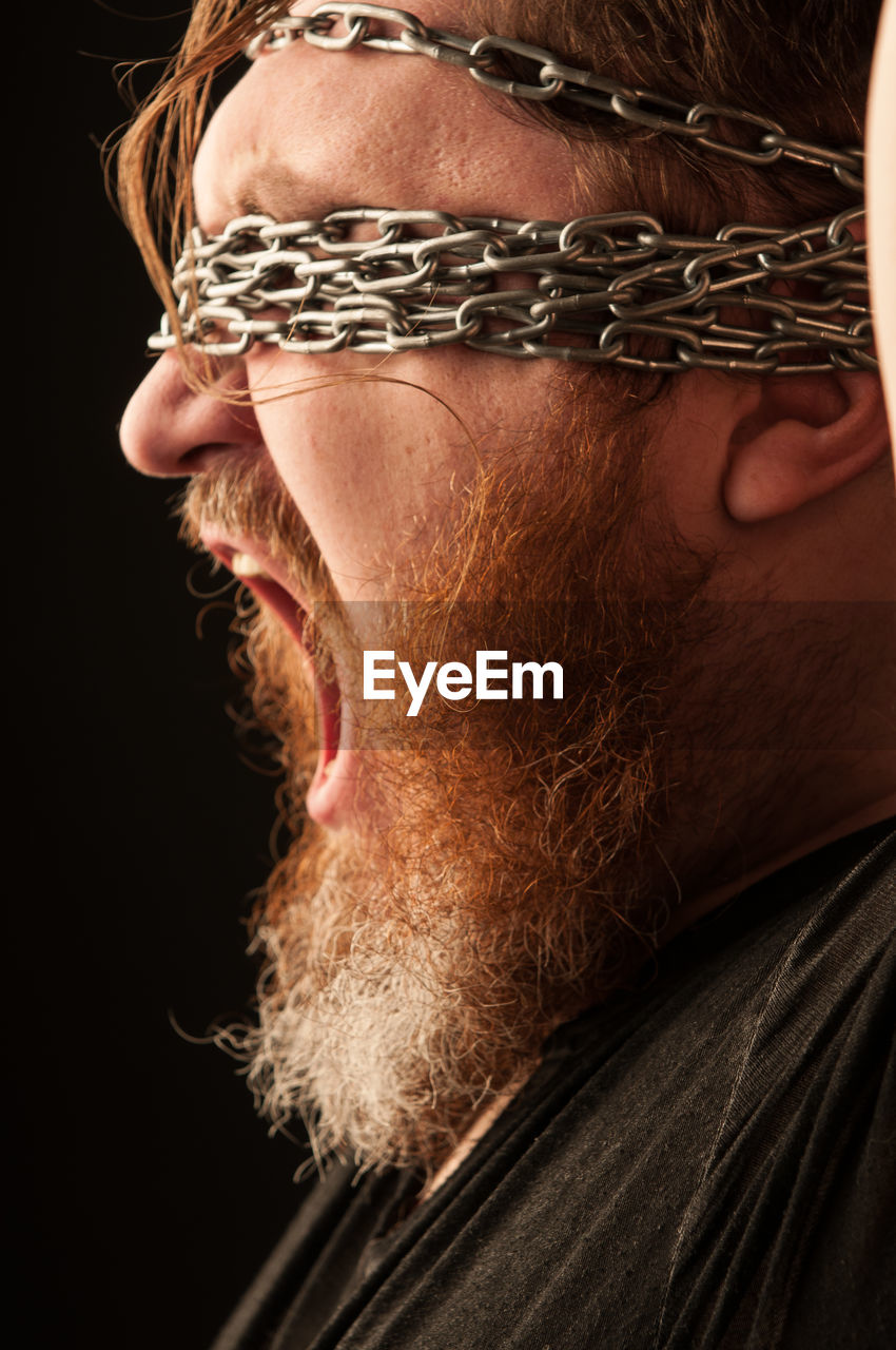 CLOSE-UP PORTRAIT OF A MAN WITH EYES