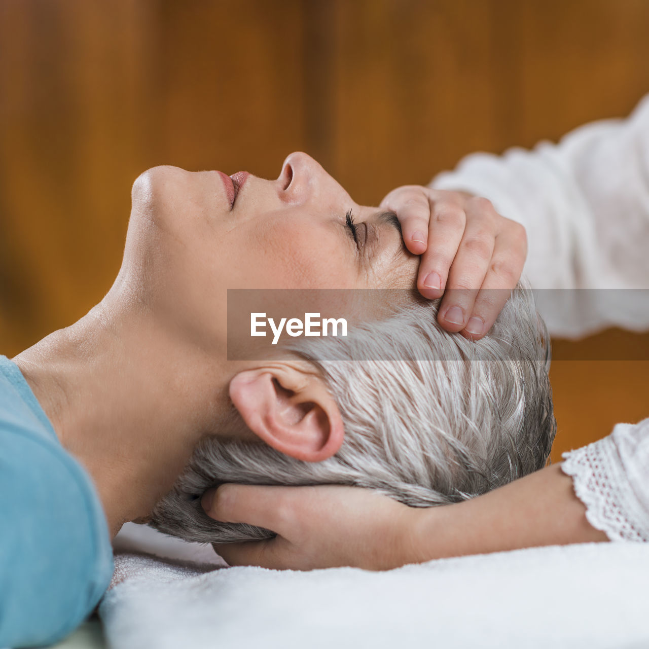 Close-up of woman getting massage at spa