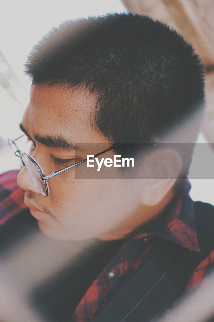 Close-up portrait of boy looking away