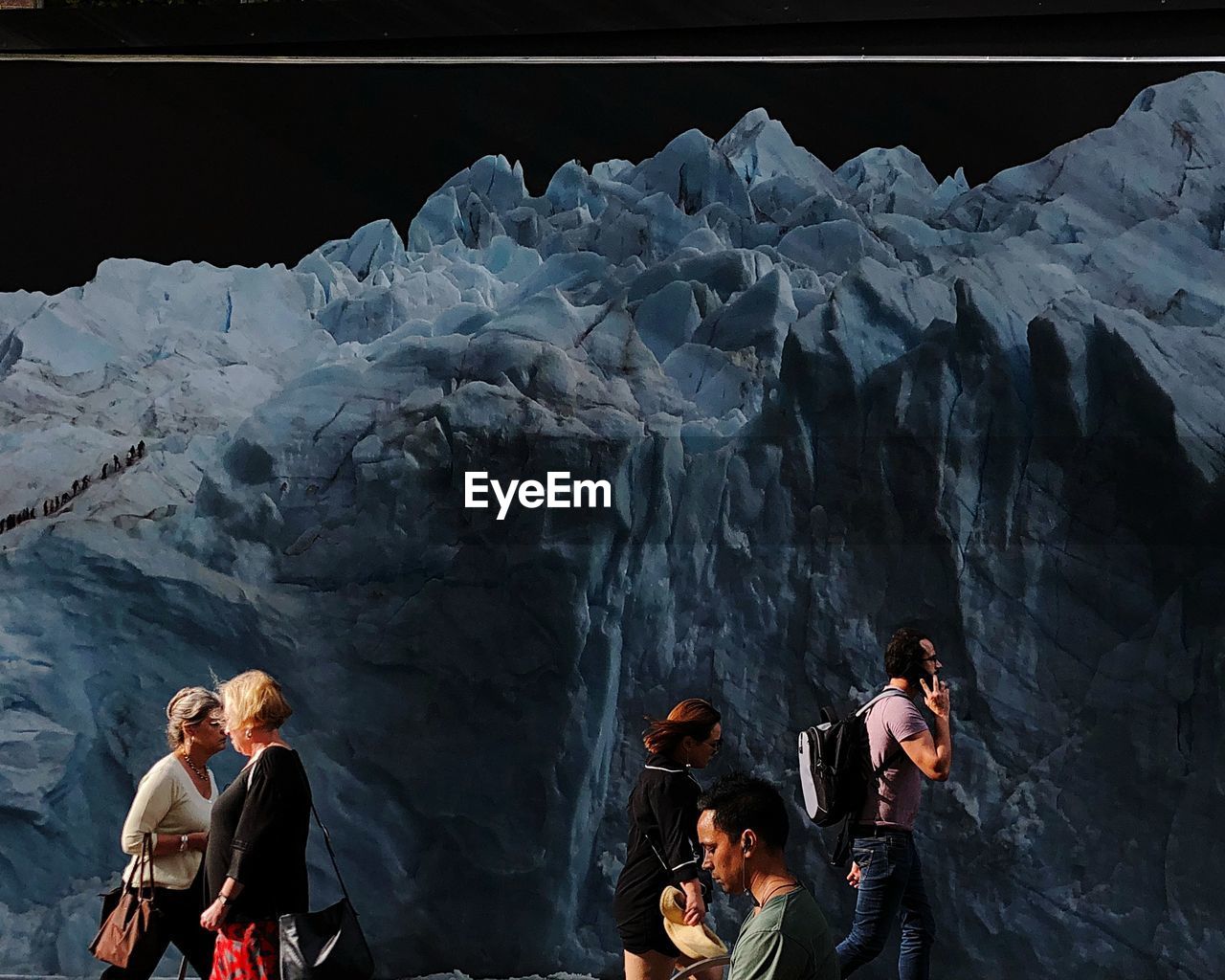 FRIENDS STANDING IN CAVE