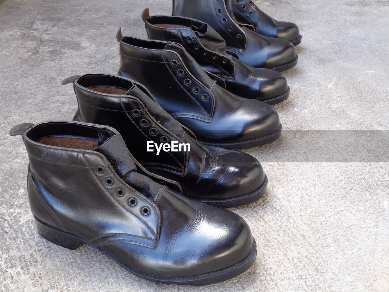 HIGH ANGLE VIEW OF SHOES ON FLOORING