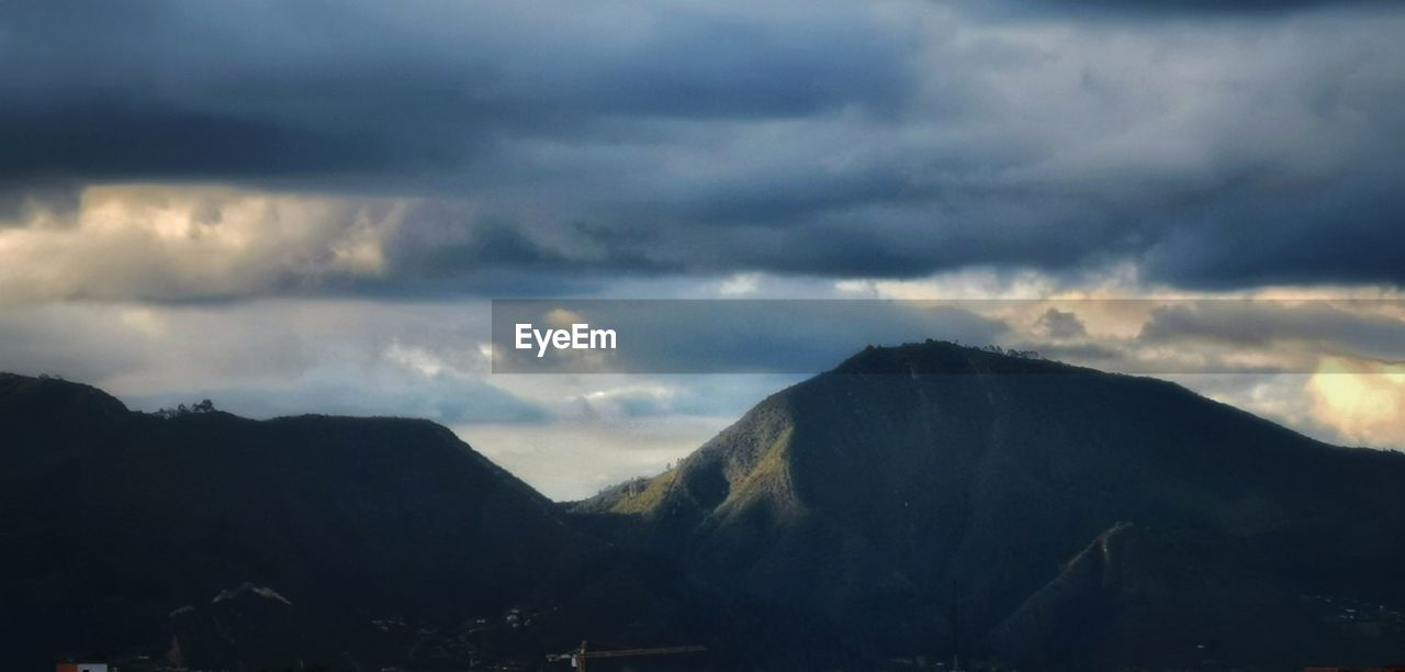 STORM CLOUDS OVER MOUNTAINS
