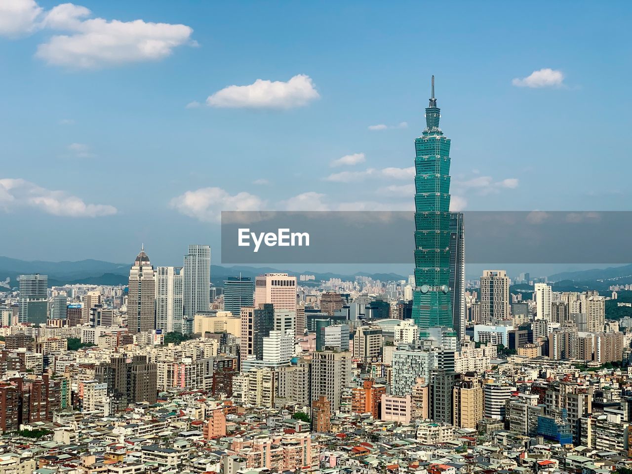 Aerial view of modern buildings in taipei against sky