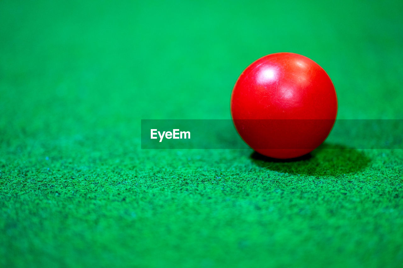 Close-up of red ball on table