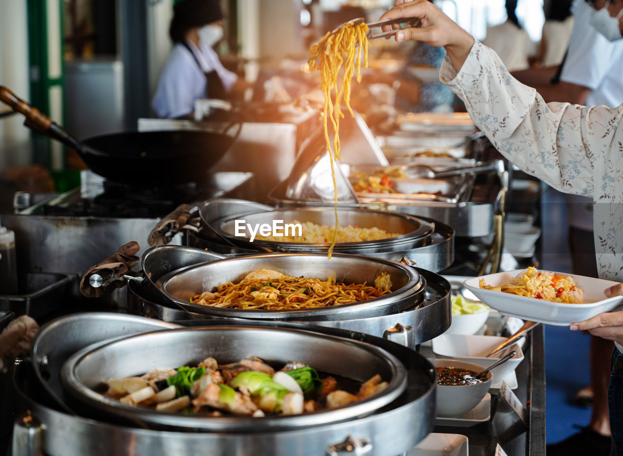 cropped hand of person preparing food