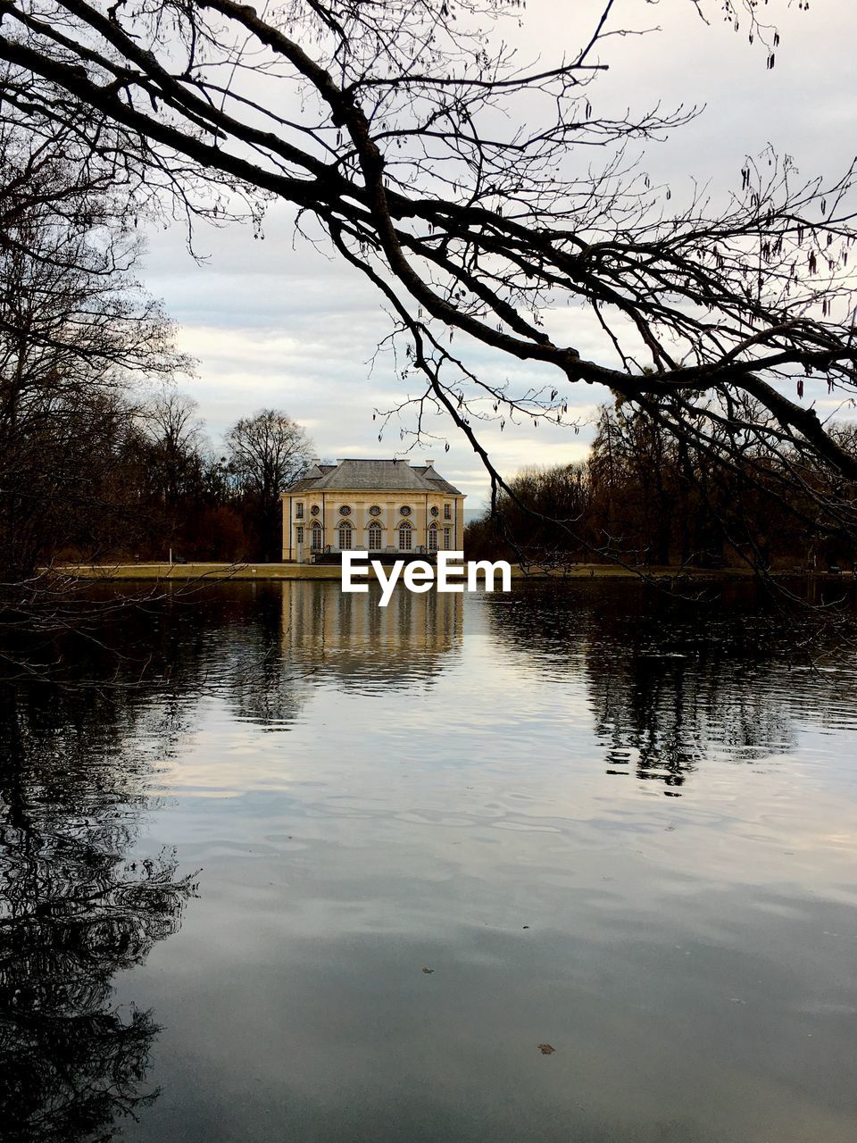 REFLECTION OF BUILDING ON LAKE