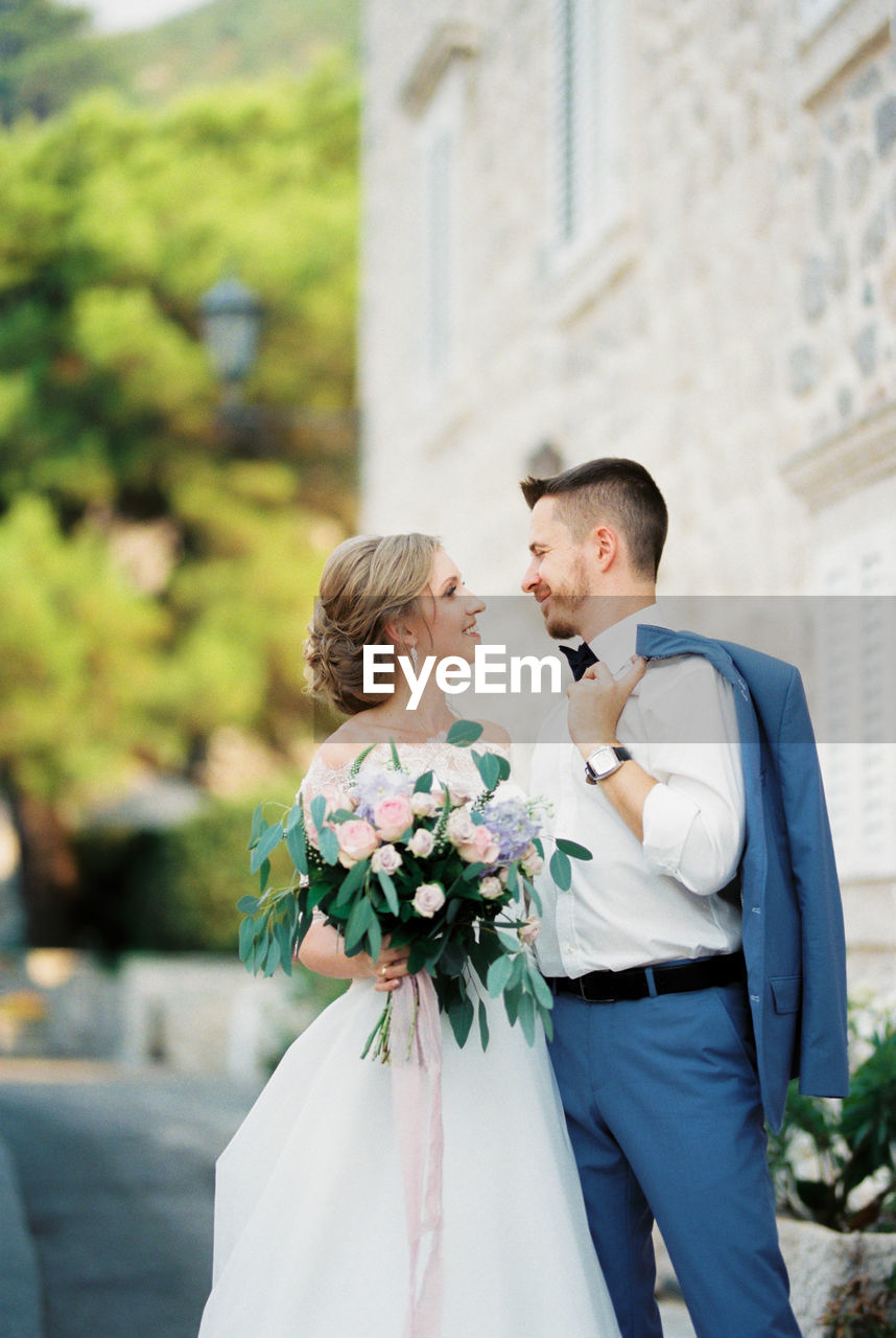 Portrait of bride holding bouquet