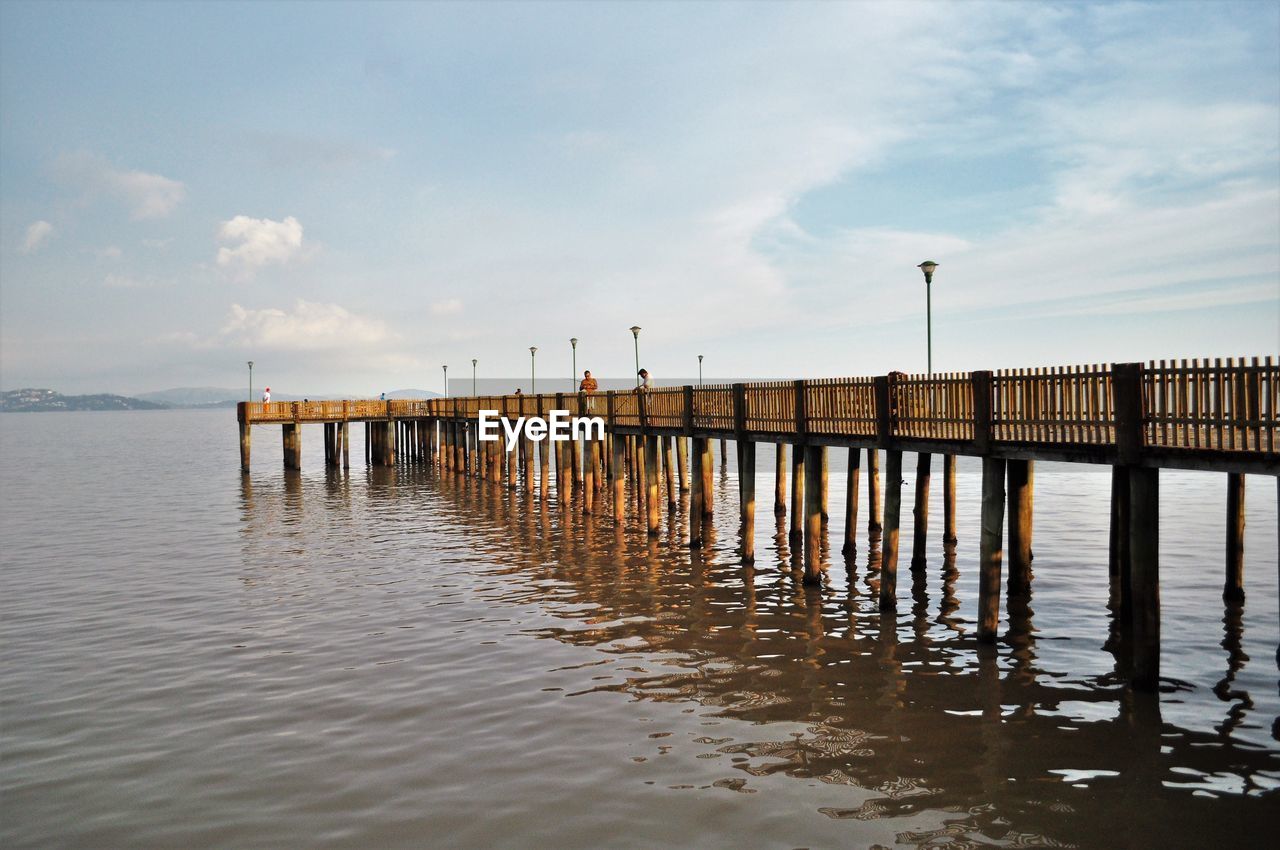 Pier on sea against sky