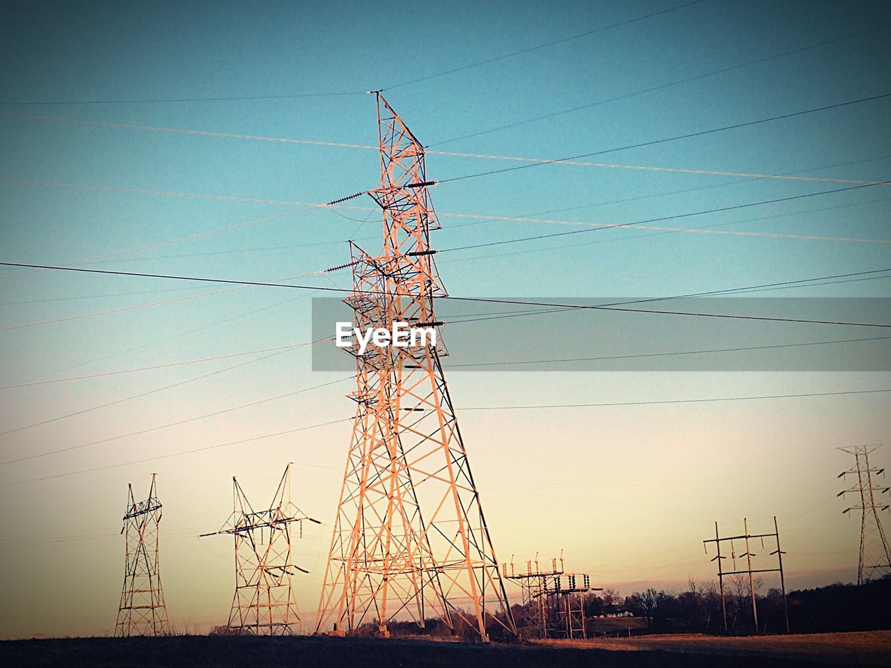 LOW ANGLE VIEW OF ELECTRICITY PYLONS AGAINST SKY