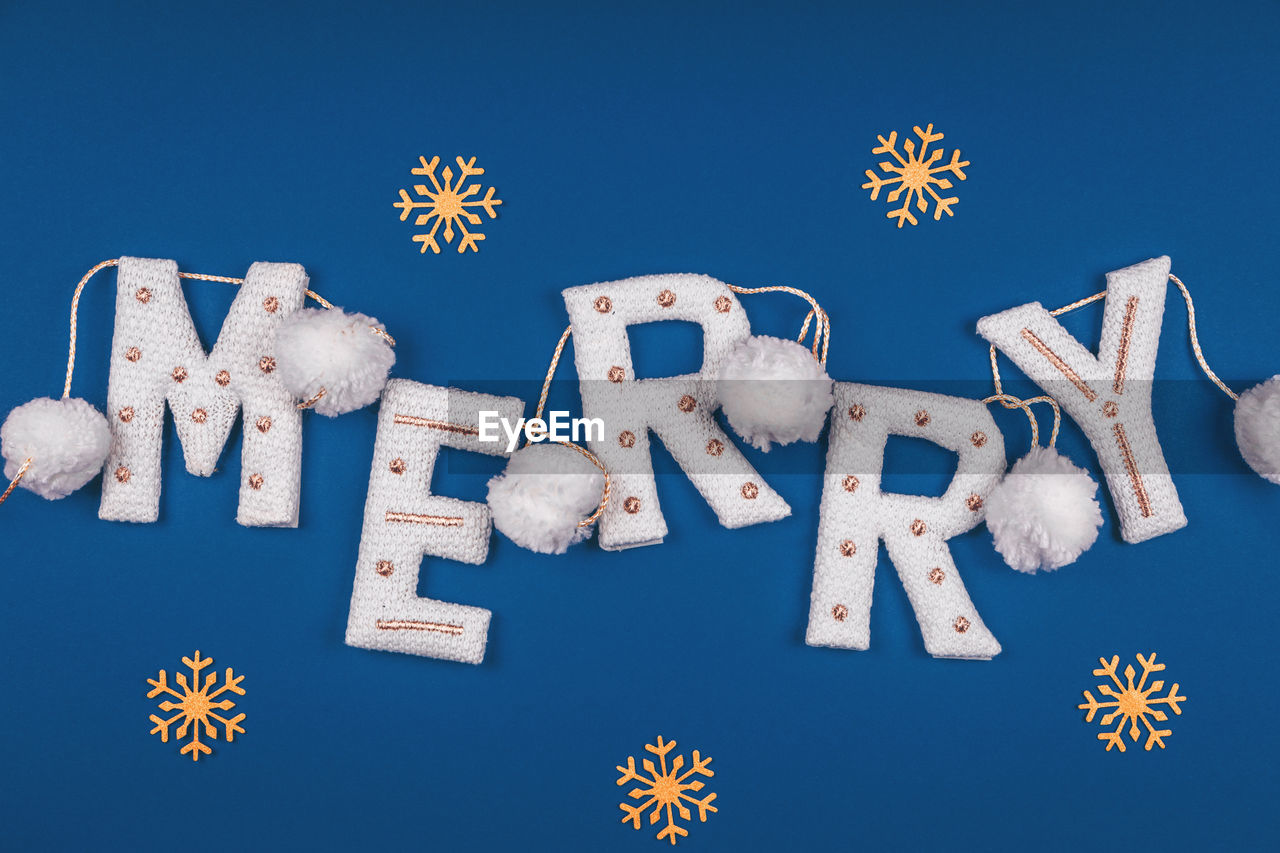 blue, blue background, colored background, snowflake, holiday, studio shot, no people, christmas, snow, winter, nature, text, celebration, sky, star shape, christmas decoration, large group of objects, shape, letter, font, cold temperature, food and drink, indoors, food, western script, communication