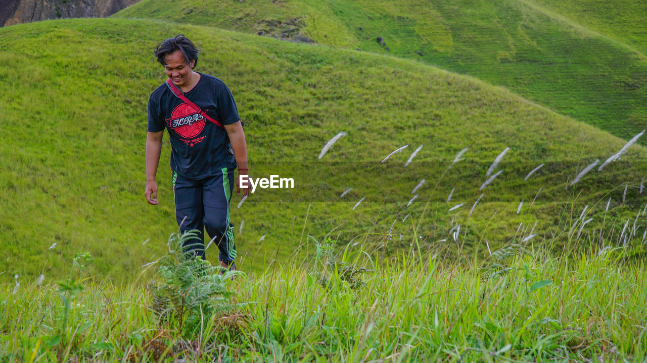 FULL LENGTH OF MAN STANDING ON FARM