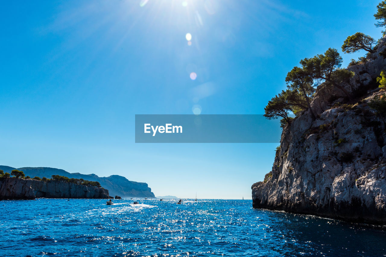 Scenic view of sea against blue sky