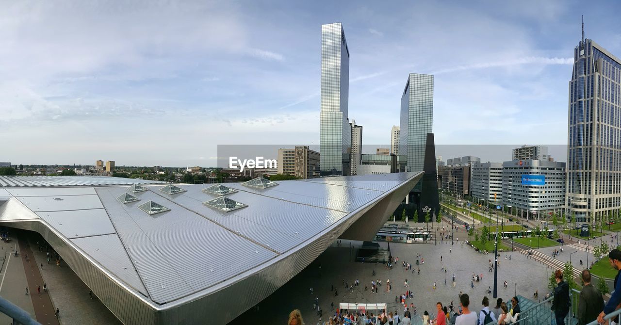 PANORAMIC VIEW OF MODERN CITY AGAINST SKY