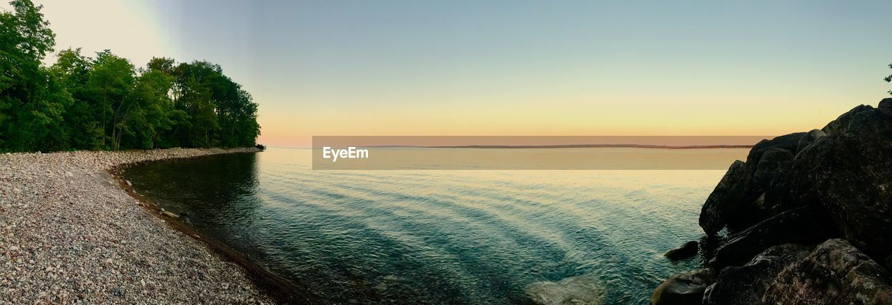 SCENIC VIEW OF LANDSCAPE AGAINST SKY AT SUNSET