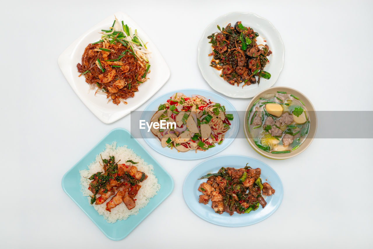 food and drink, food, healthy eating, studio shot, wellbeing, freshness, vegetable, no people, indoors, variation, high angle view, plate, bowl, dish, asian food, meal, produce, white background, still life, meat, directly above, herb