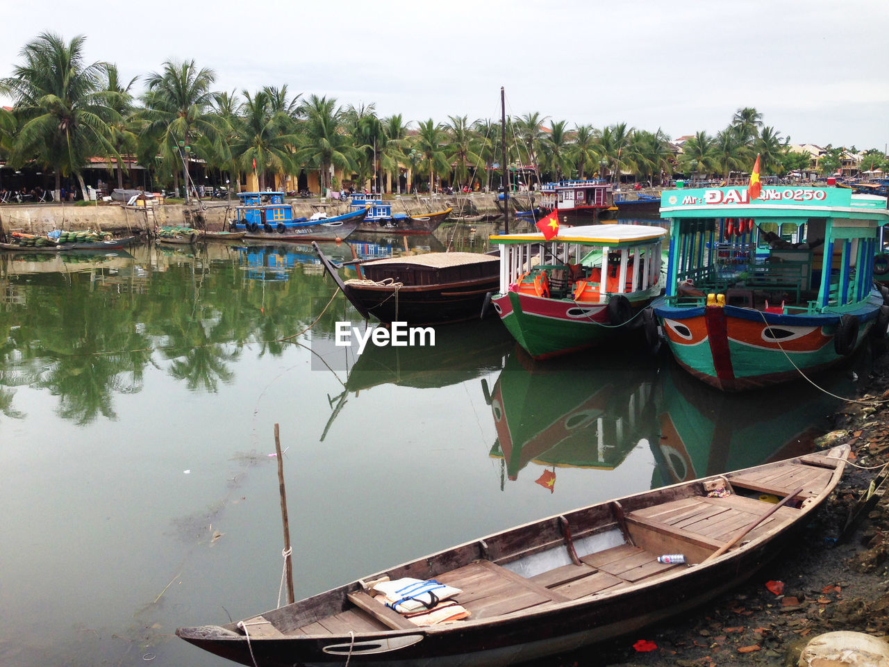 BOATS MOORED IN LAKE