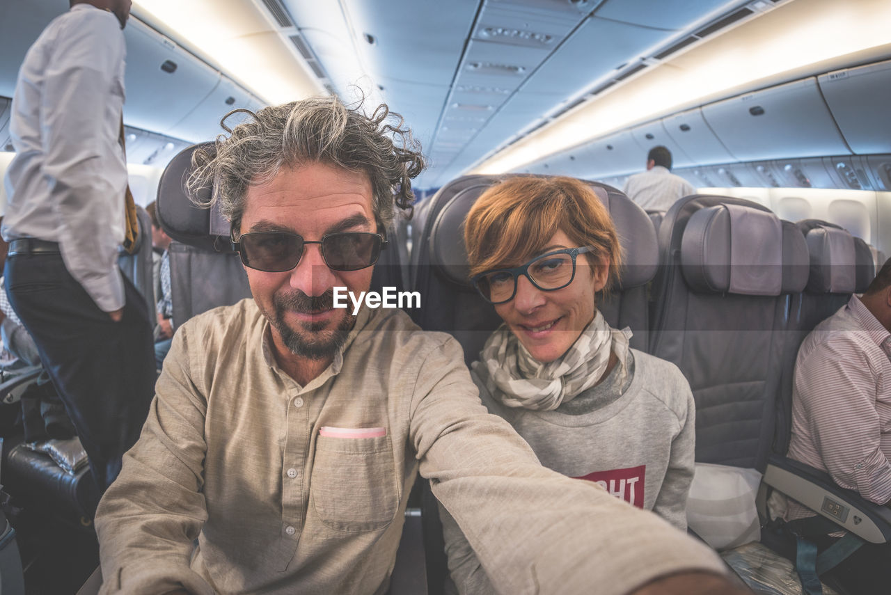 Couple sitting in airplane