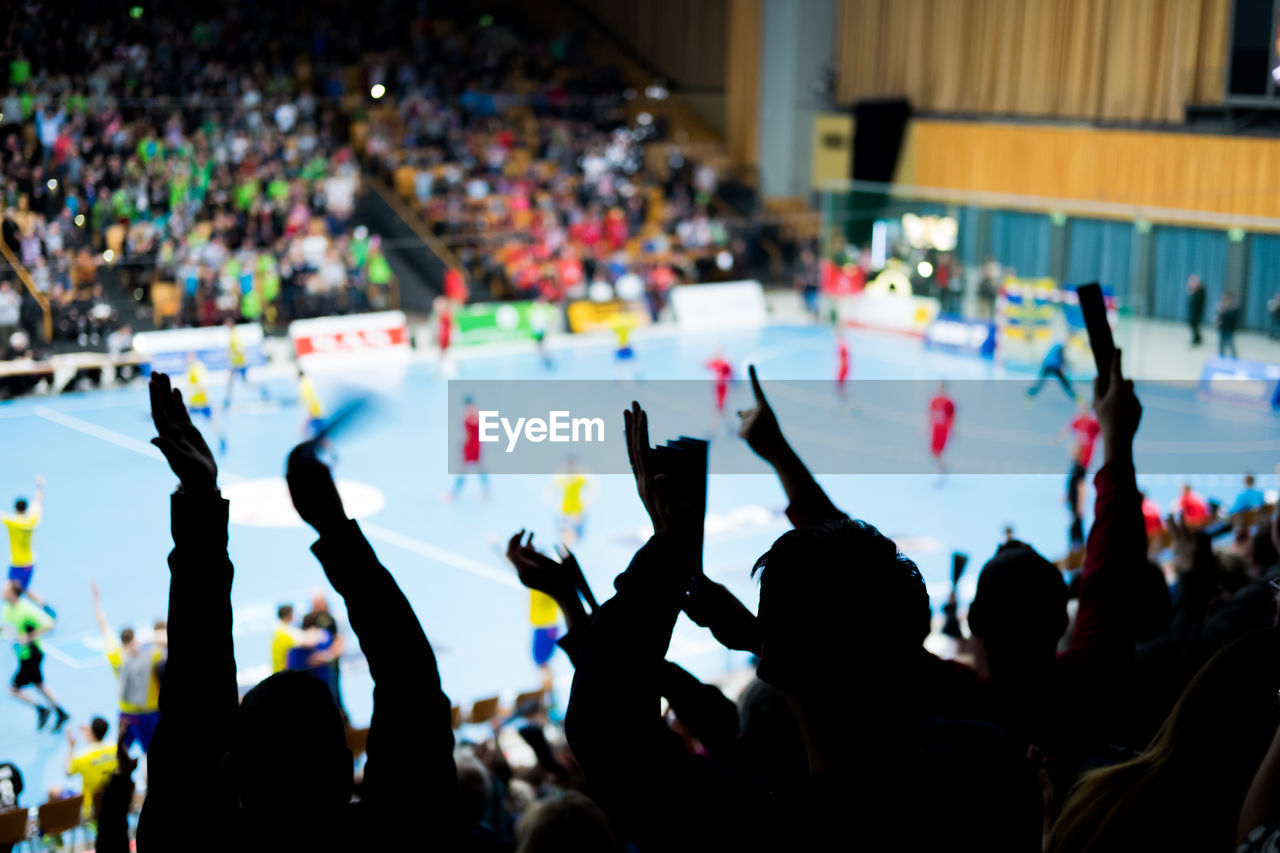 Spectators watching football match