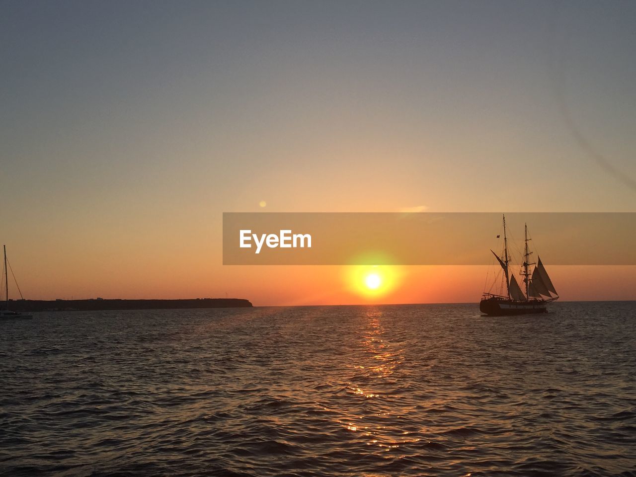 View of ship sailing in sea during sunset