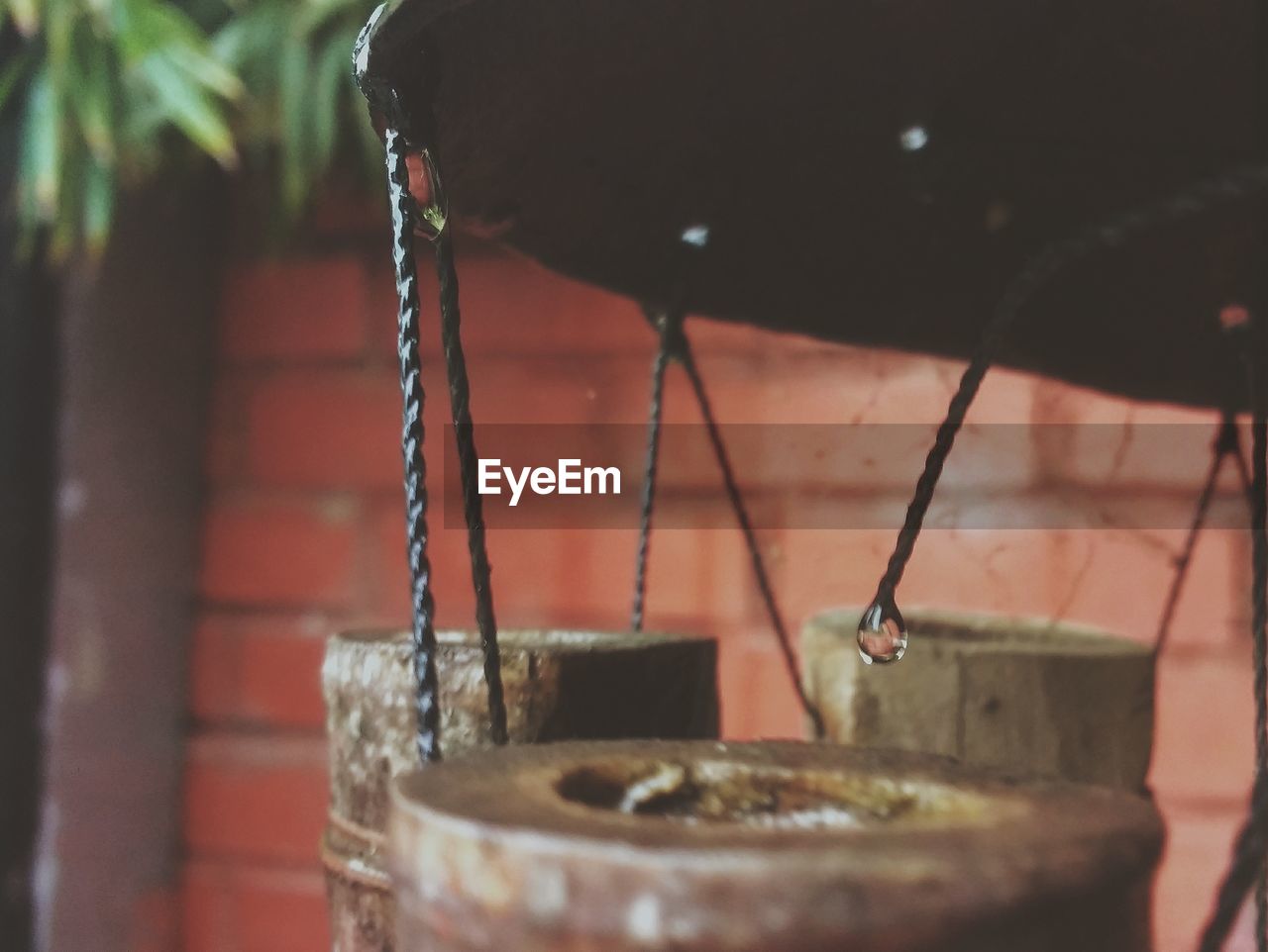 CLOSE-UP OF WATER FROM FAUCET IN CONTAINER