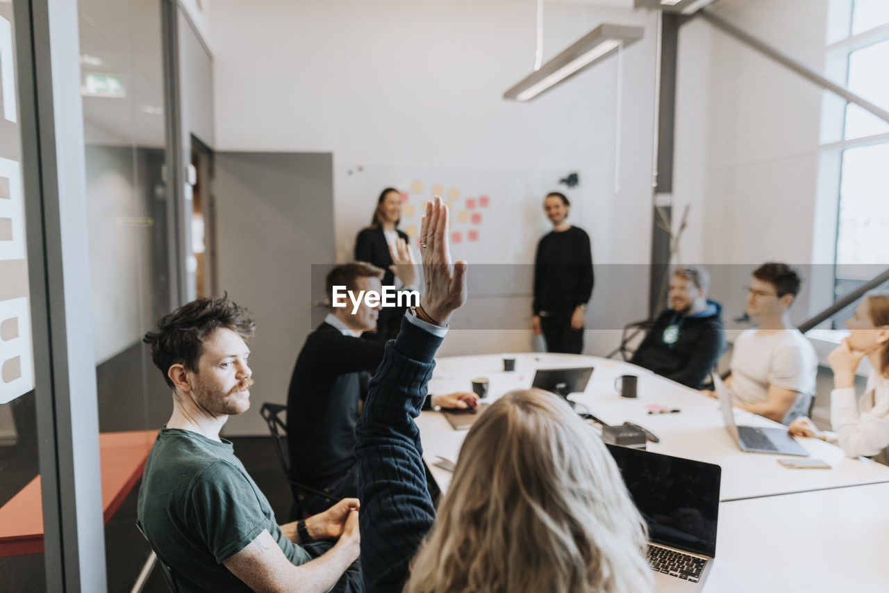 People having presentation during business meeting