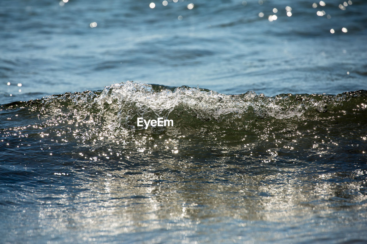 Crystal wave of summer cyprus with sunny reflections