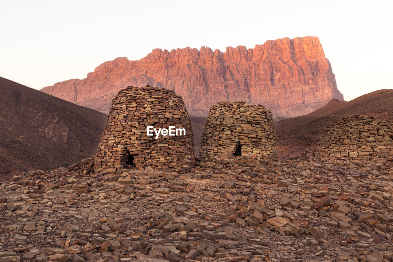 ROCK FORMATIONS AGAINST ROCKY MOUNTAINS