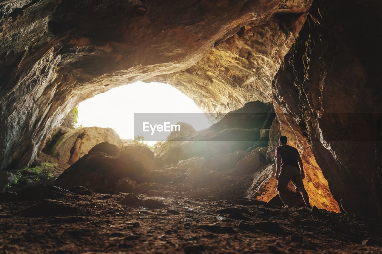 Man standing in cave