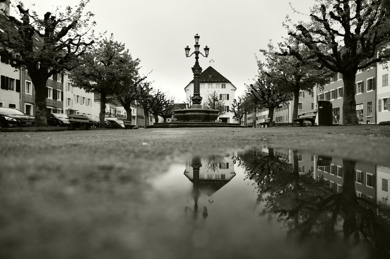 REFLECTION OF BUILDINGS IN WATER