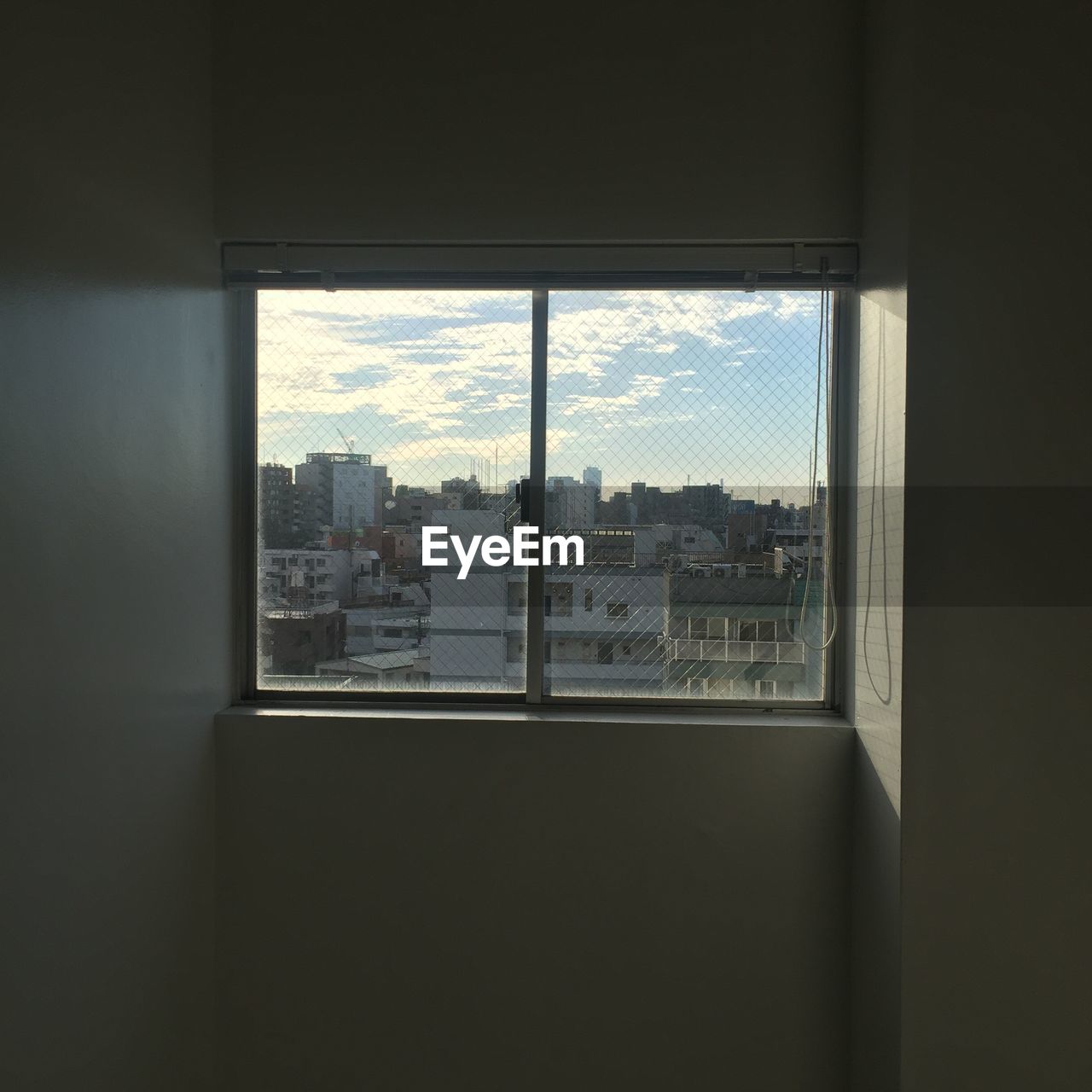 CITYSCAPE SEEN THROUGH WINDOW