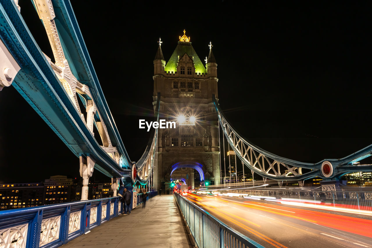 ILLUMINATED LIGHT BRIDGE AT NIGHT