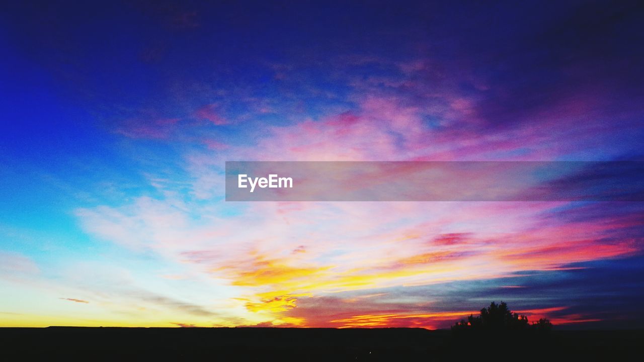 Scenic view of silhouette landscape against sky during sunset