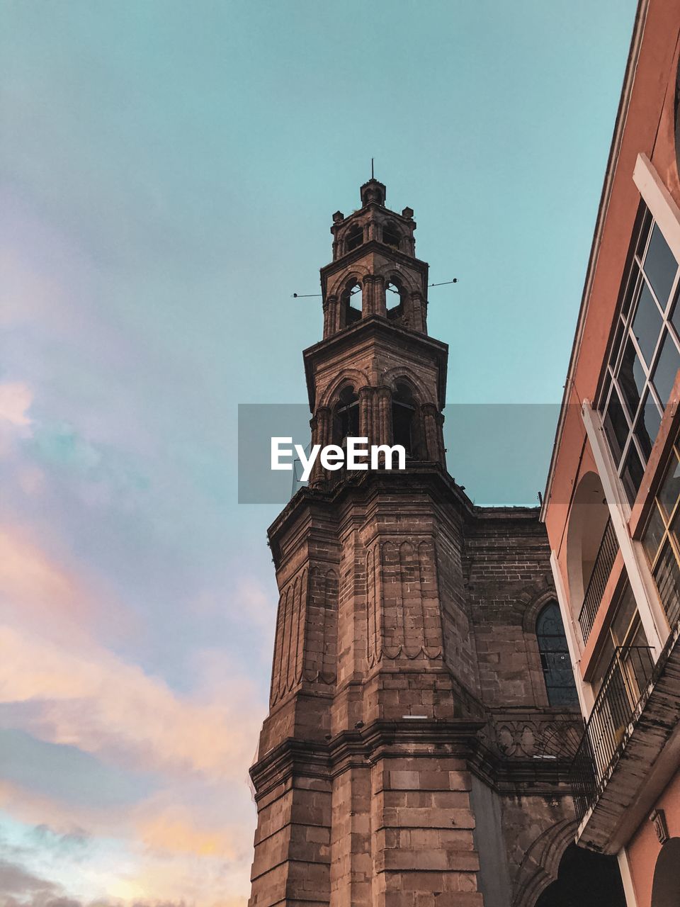 Low angle view of clock tower against sky