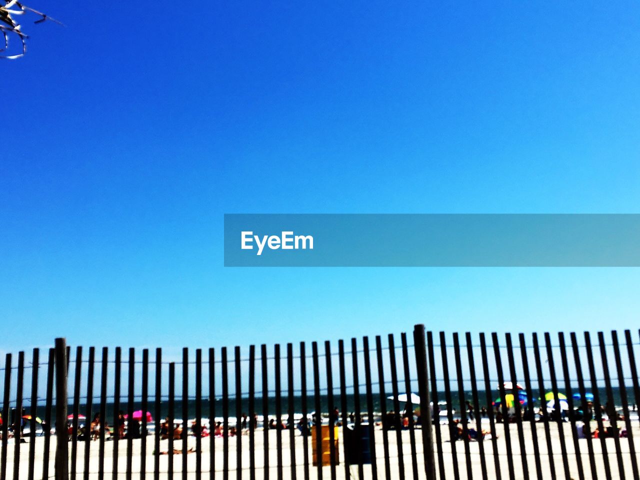 SILHOUETTE OF RAILWAY BRIDGE AGAINST CLEAR BLUE SKY