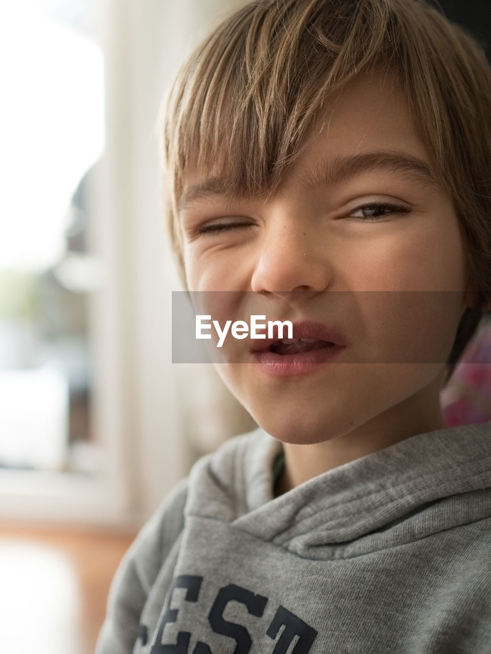 Portrait of boy winking at camera