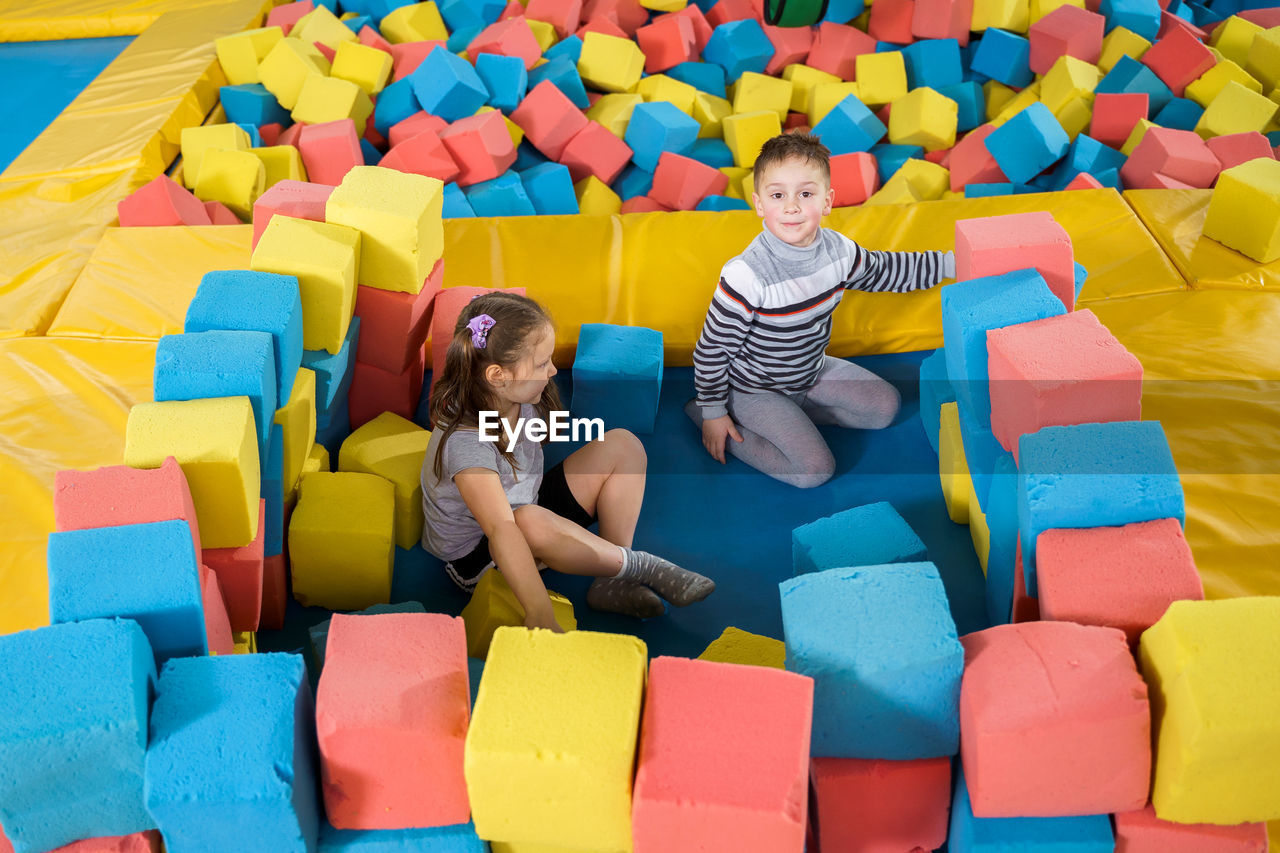 High angle view of people sitting in toys