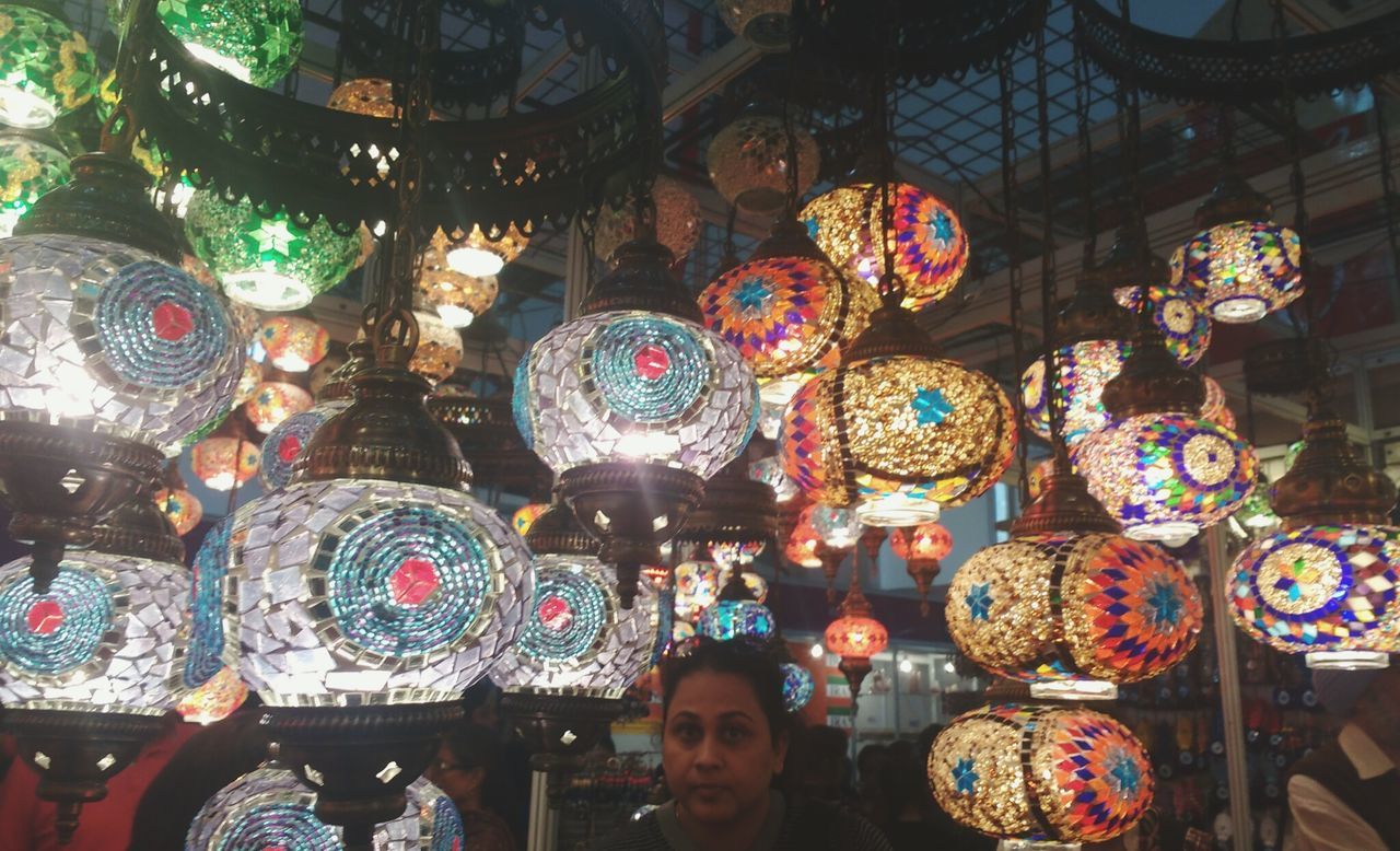 ILLUMINATED LANTERNS HANGING IN STORE