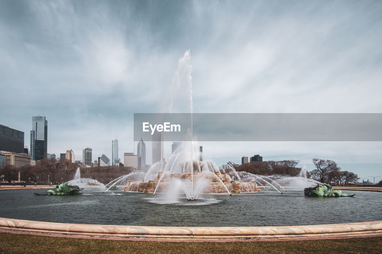 VIEW OF FOUNTAIN AGAINST BUILDINGS