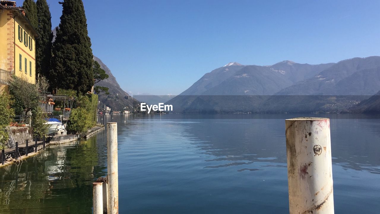 SCENIC VIEW OF LAKE AGAINST MOUNTAIN RANGE