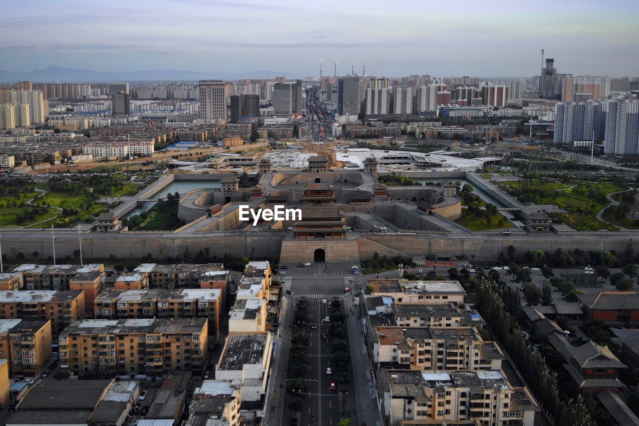 High angle view of buildings in city against sky