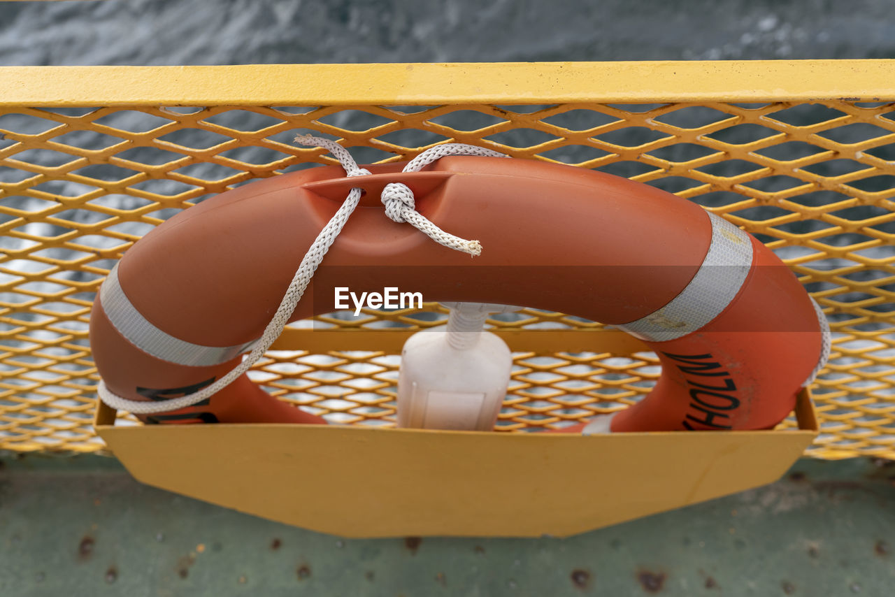 High angle view of orange lifebuoy on a boat