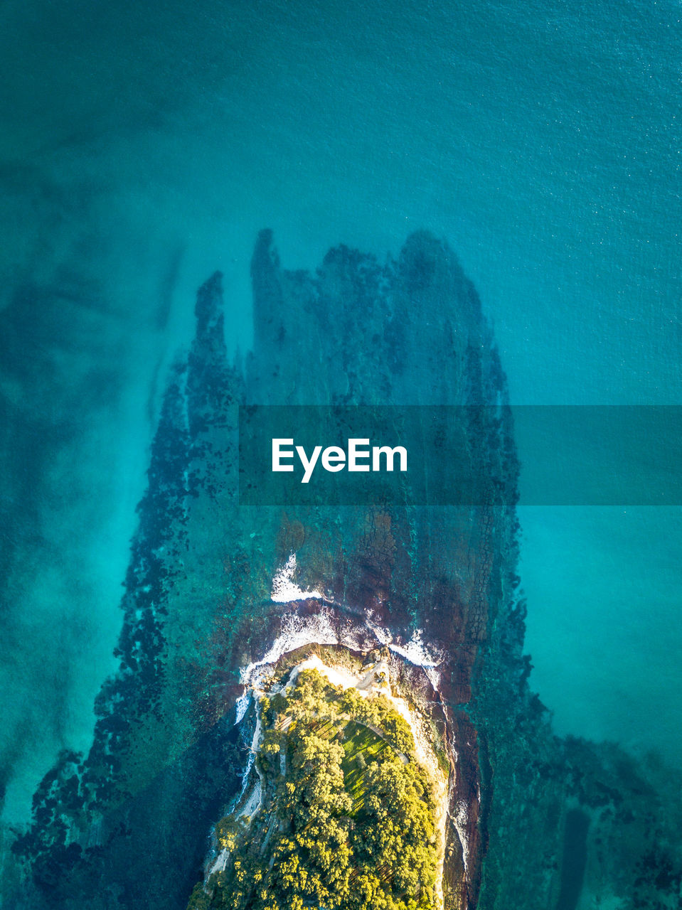 High angle view of rock formation in sea