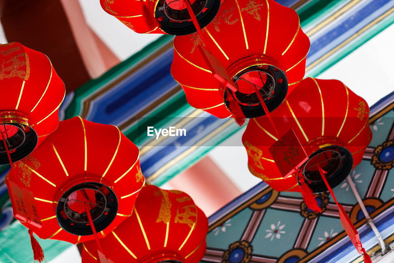 LOW ANGLE VIEW OF RED LANTERNS IN TRADITIONAL