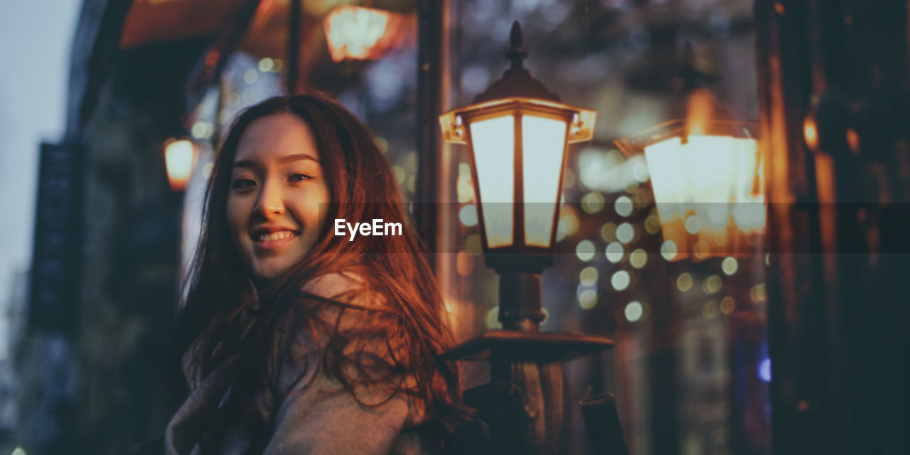 Asian young woman in the street in the night