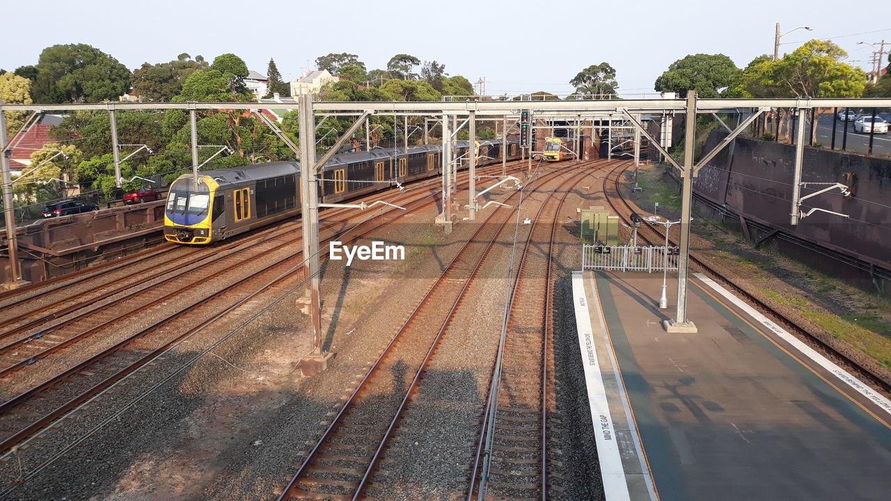 TRAIN ON RAILROAD STATION PLATFORM