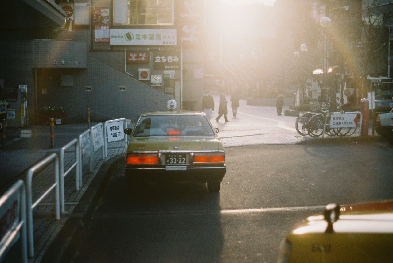 CARS ON STREET IN CITY