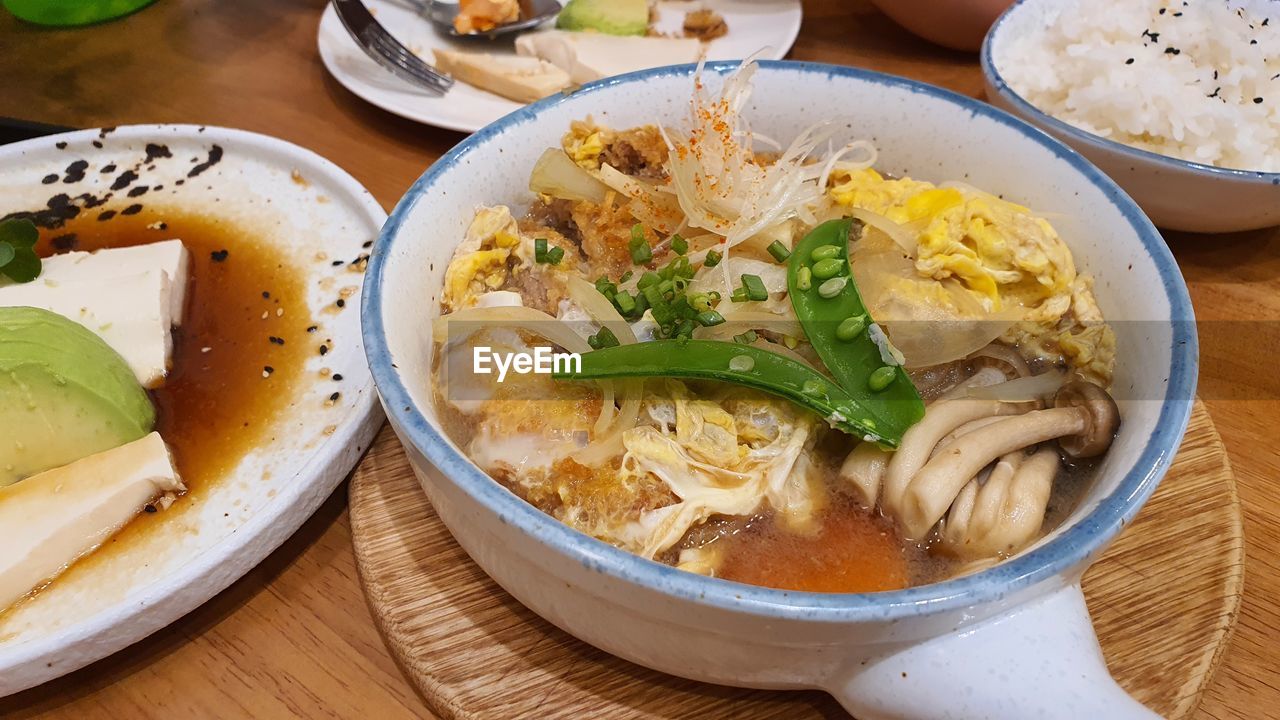 food and drink, food, healthy eating, freshness, wellbeing, bowl, asian food, table, dish, lunch, vegetable, cuisine, meal, no people, pasta, indoors, high angle view, soup, italian food, noodle, plate, serving size, meat, noodle soup, still life, thai food, chinese food, japanese food, crockery